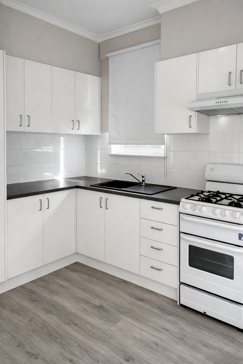 white kitchen with black bench top
